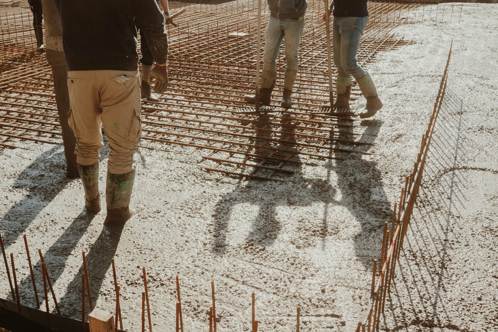 Rebar-reinforced concrete slab being poured